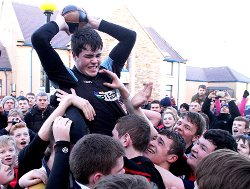 Henry Gordon is raised aloft with his ba' by team-mates. (www.theorcadianphotos.co.uk)