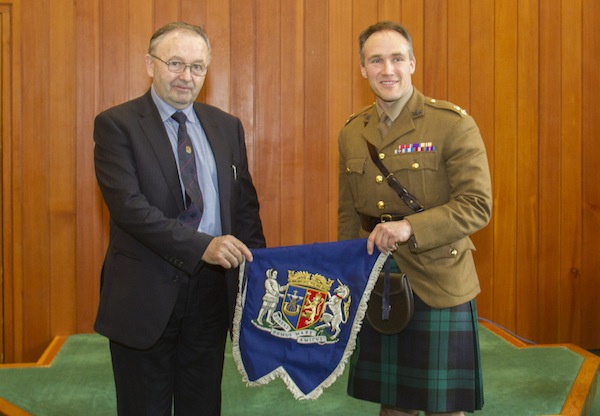 OIC vice-convener Jim Foubister (left) presents Lt Col Leigh Drummond MBE with the banner.