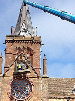 The inspection of the window in the South Transept of St Magnus Cathedral under way on Sunday.