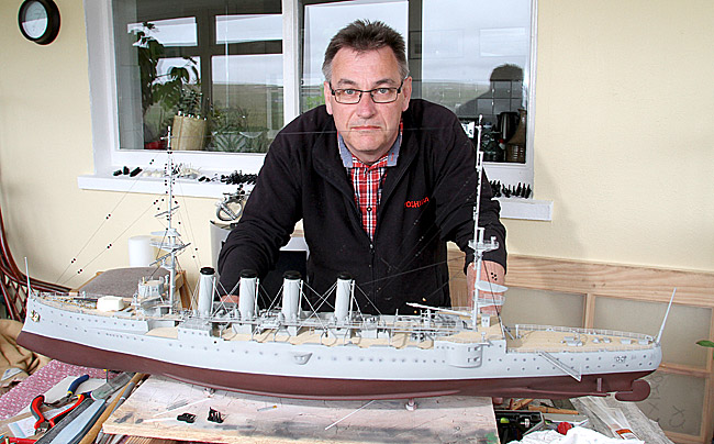 of Peedie Models, at work on his replica of HMS Hampshire.