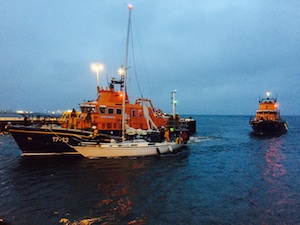 Kirkwall and Stromness Lifeboats entering Kirkwall Harbour late last night with the yacht. (Picture: Craig Taylor)