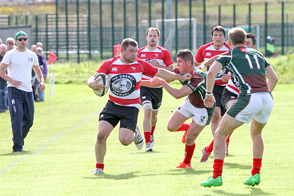 Orkney's Scott Rendall fends off a GHA challenge last weekend, a match which Orkney would end up on the losing side.