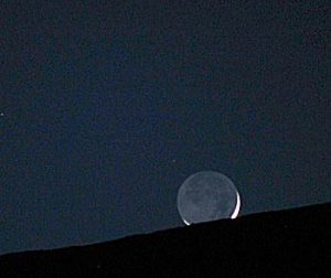 Young Moon cradles the old