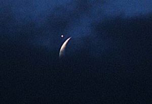 Clouds part to allow view of conjunction