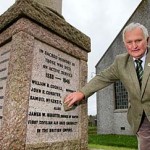 Chairman of the Firth and Stenness Community Council, Eoin Scott, with the Stenness War Memorial.
