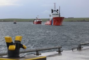Coastguard tug arrives alongside with trawler