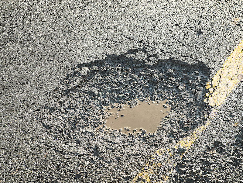 Councillor digs into pothole problem