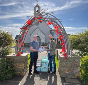 Medal handover as Orkney 2025 beckons